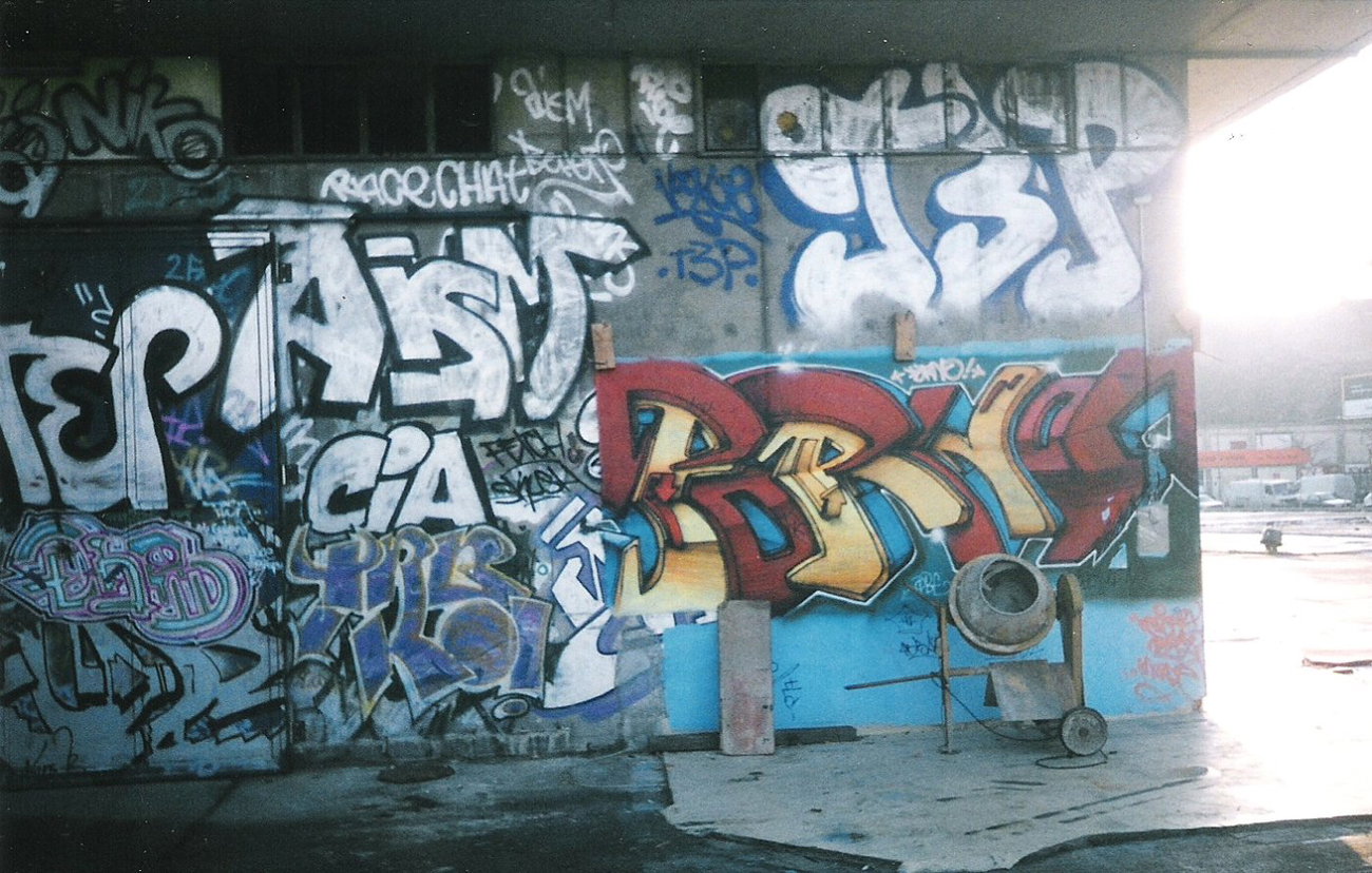 Graffiti Wall in Berlin - Photo by COLLECTOR - Porno, Aism, CIA