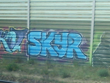 Graffiti Wall - Photo by DerKoeter - skyr, ra, crew