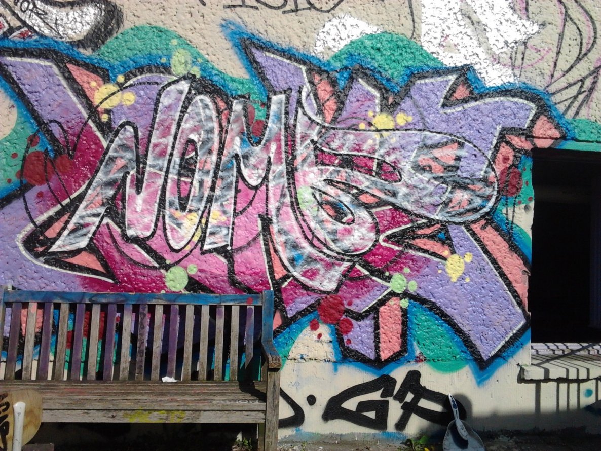 Graffiti Wall in Berlin - Photo by Hauswart1120 - NOMB, WISO (2015)