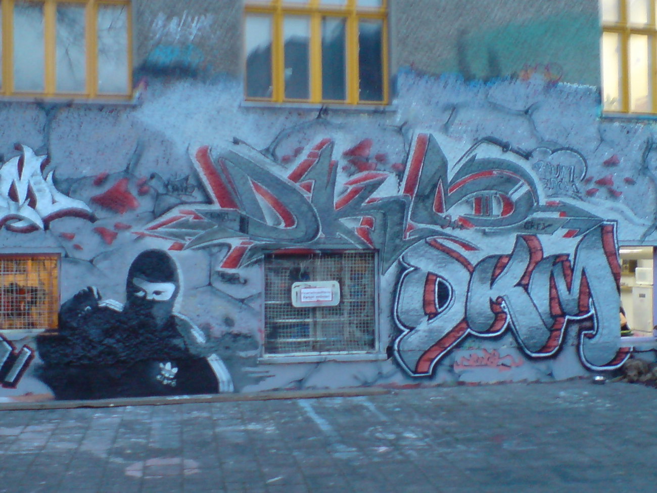 Graffiti Wall in Berlin - Photo by Hauswart1120 - DKM, EARL, NEWTON