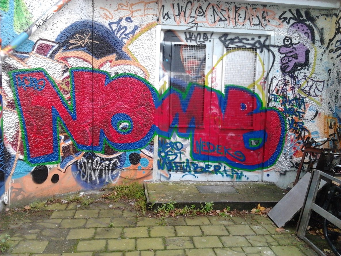 Graffiti Wall in Berlin - Photo by Hauswart1120 - NOMB, NEDEK (2014)
