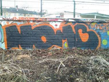 Graffiti Wall in Berlin - Photo by Hauswart1120 - NOMB, NEDEK (2014)