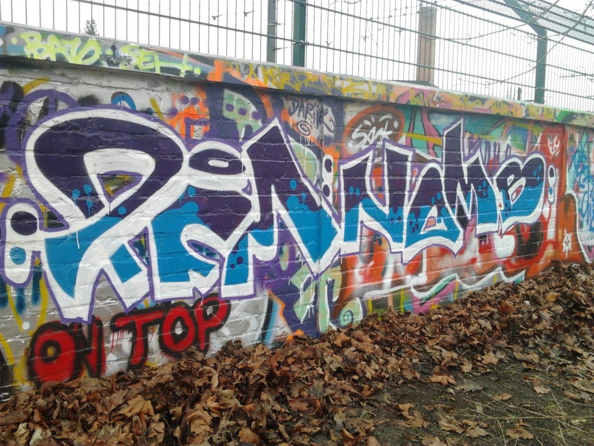 Graffiti Wall in Berlin - Photo by Hauswart1120 - PFM, NOMB, NEDEK (2015)