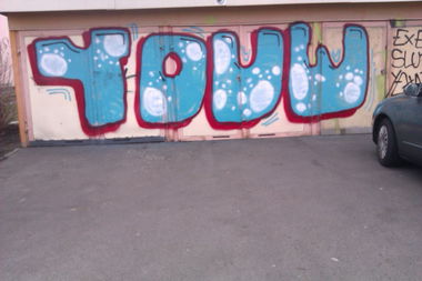 Graffiti Bombing - Photo by ICD10 - YOUW, YC, Slut (2012)
