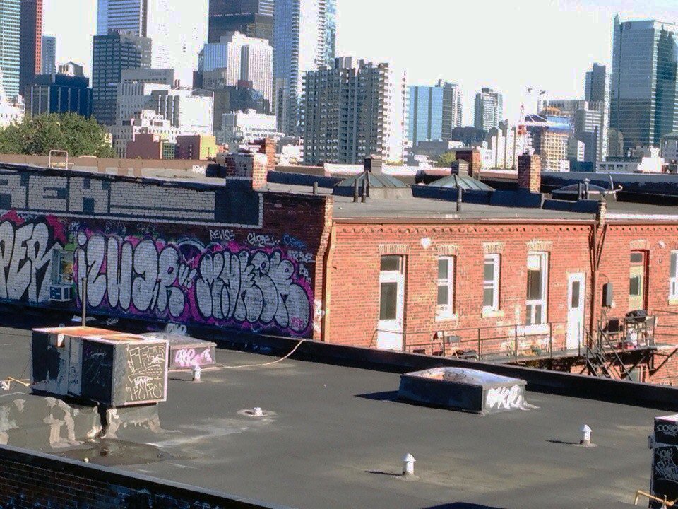 Graffiti Bombing in Toronto - Photo by MUKER - Chinatown, Rooftop, Canada (2013)
