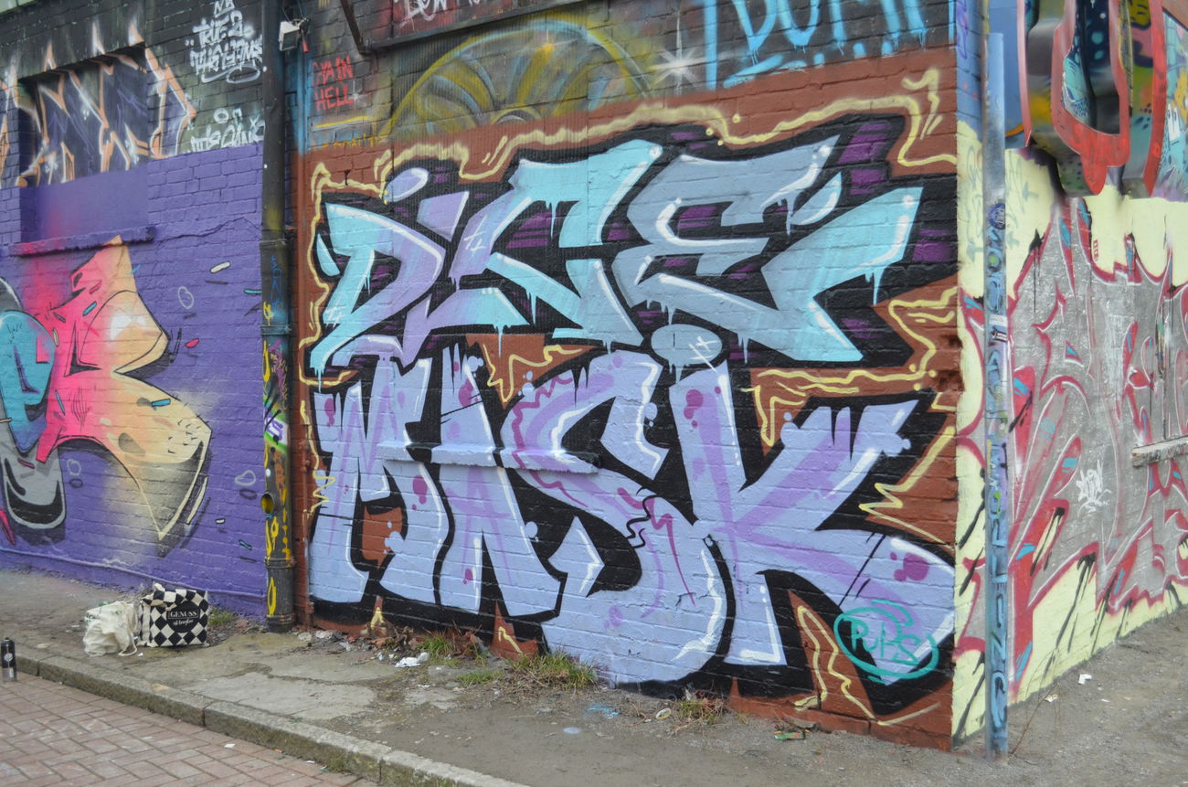 Graffiti Wall - Photo by MisterDiceOne - dice, mask, glocksee