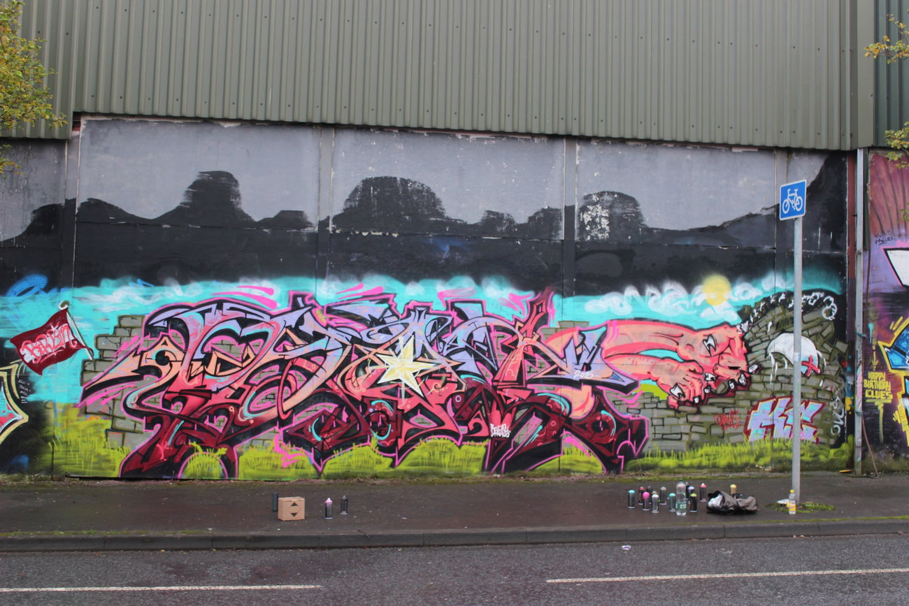 Graffiti Wall in 15 Cupar Way - Photo by Shroom - prot, kc, belfast (2016)