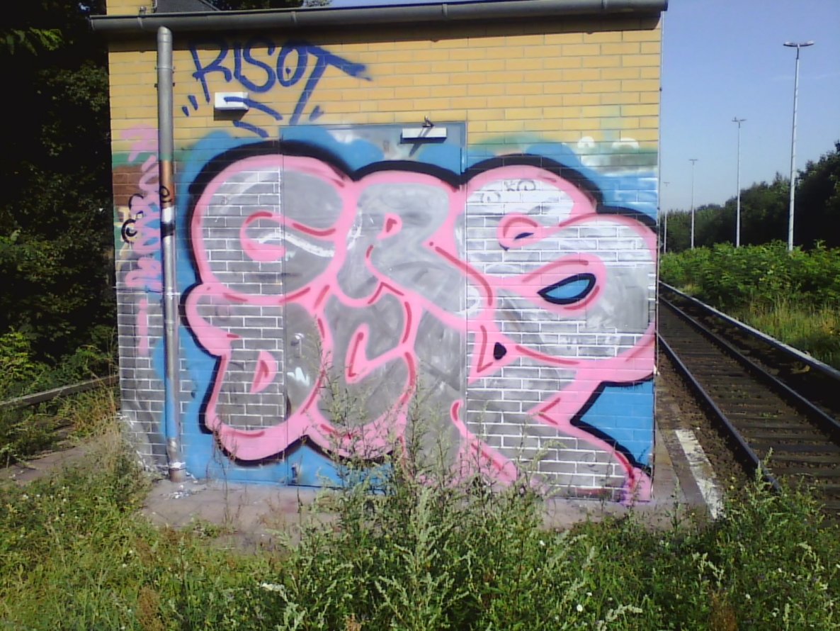 Graffiti Wall in Berlin - Photo by User28 - GRS, DCK, QUK (2013)