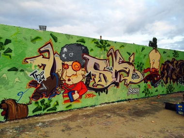 Graffiti Wall in Berlin - Photo by User28 - QUK, vosck (2014)
