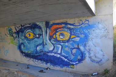 Graffiti Bombing in Vienna - Photo by Wolfneck - blue, face, character