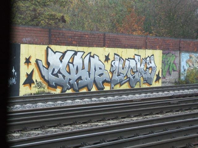 Graffiti Bombing - Photo by escyOne - cyrus, lucky