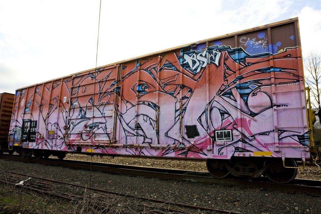 Graffiti Train in Independence - Photo by justmy2cents - Kwest, BSM, freight (2011)