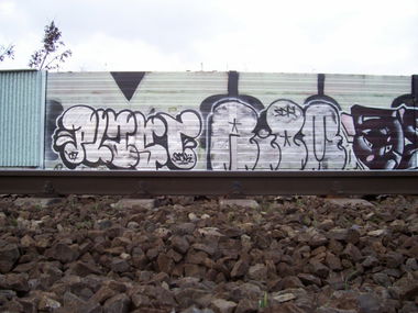Graffiti Bombing - Photo by plasticdopesme - train, line, wall