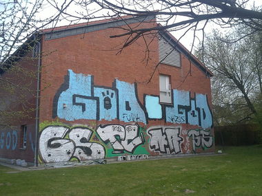 Graffiti Bombing - Photo by unknown - god, mfg (2011)